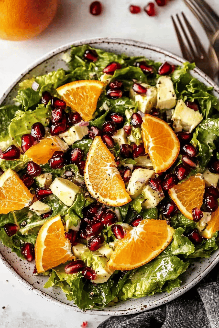 Orange Pomegranate Salad ingredients organized and measured on kitchen counter