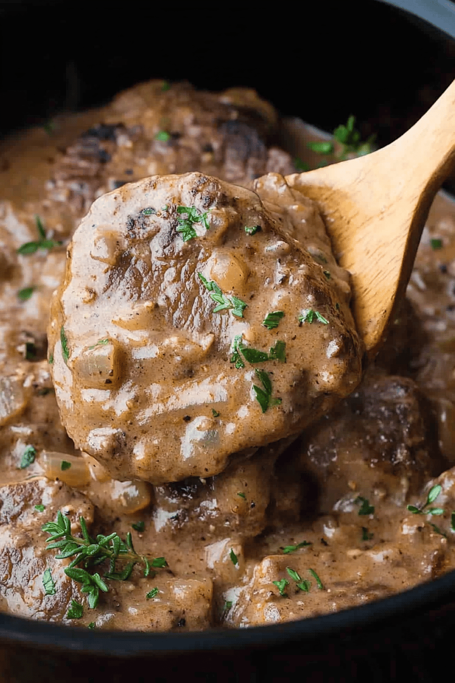 Crockpot Cubed Steak slice on plate showing perfect texture and swirl pattern